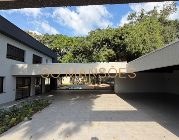 CASA DE 470M² À VENDA NO BANDEIRANTES — SOFISTICAÇÃO, PRIVACIDADE E MUITO VERDE NA PAMPULHA.